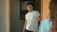 Tom greets Lilli, but beneath the charm lie unanswered questions about his true motives (Image via Netflix)